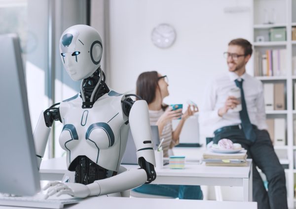 Efficient AI robot working in the office and lazy employees having a coffee break